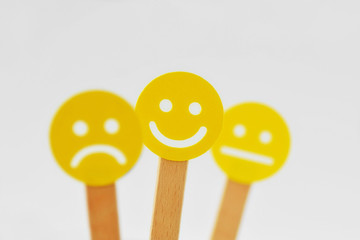 Yellow smiley faces with positive, neutral and negative expression - Positivity concept