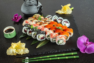 tasty sushi on black background