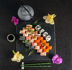 tasty sushi on black background