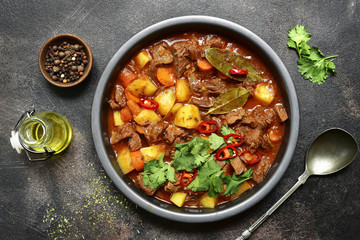 Meat stewed with vegetables in tomato sauce (hungarian goulash) .Top view with copy space.