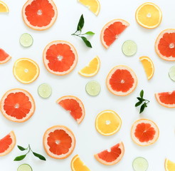 Citrus fruits pattern composition top view background. Lime, grapefruit, orange,   on white background. Summer food concept. Flat lay,  