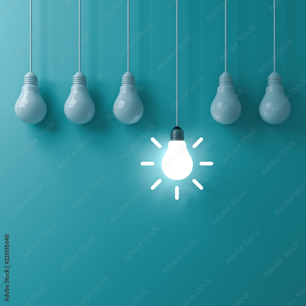 Fototapete think different concept one hanging glowing idea light bulb standing out from dim unlit bulbs on gre