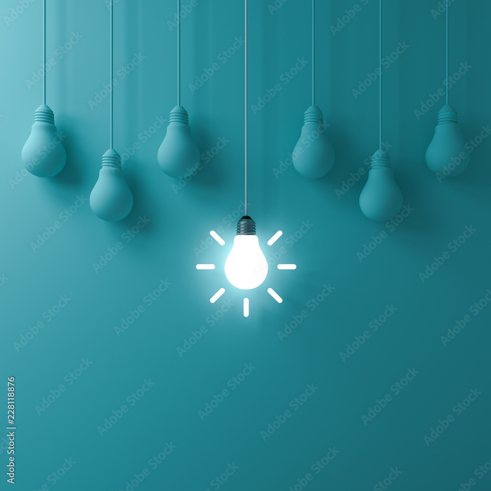 Leinwandbilder think different concept one hanging glowing idea light bulb standing out from dim unlit bulbs on gre