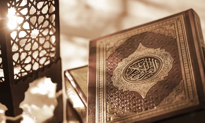 Fotobehang Islamic Book Koran with rosary on grey © BillionPhotos.com