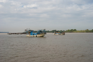 Fishing boats in Guadalquivir river, Andalucia, Spain