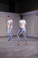 Young man enjoying dancing with her beautiful partner. Wow dancing performance.