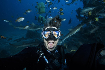 Pancking and Scared Scuba Diver Underwater with Mouth Wide Open