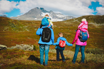 Fototapeta na wymiar family with kids hiking in mountains, nature travel