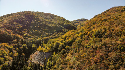 Aerial view of mountains in national park Cheile Nerei Beusnita in Romania. Part of Carpathian mountains with beautiful autumn colors.