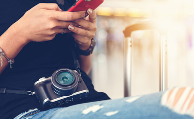 Woman sitting on seat at airport