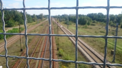 A wire fence and railway tracks in the background © E-lona