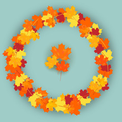 Colorful wreath made from maple leaves, red, yellow, orange autumn foliage