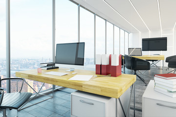 Modern office with blank laptop