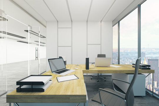 Contemporary office with blank laptop