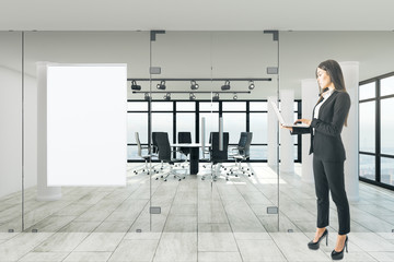 Woman in office with frame