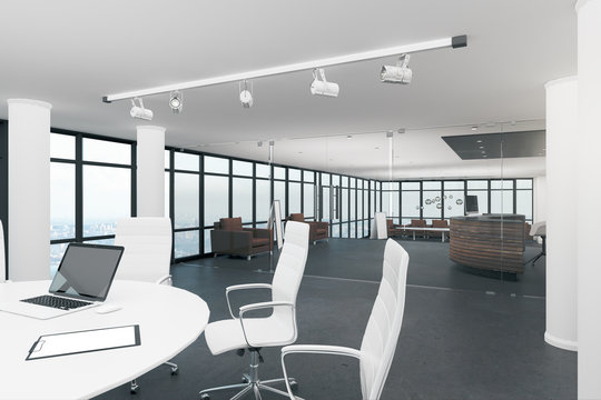 White meeting room with laptop
