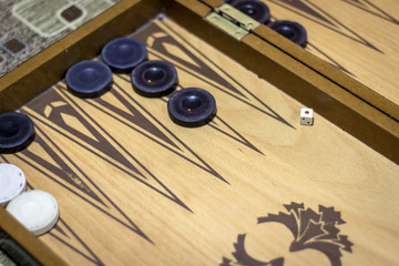 Angled shoot of dice of backgammon under dim light