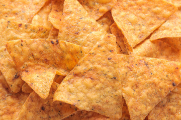 Background of a lot of chips, nachos close-up. Snacks. unhealthy food.