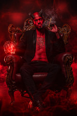 Fototapeta premium wicked man in armchair