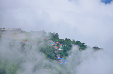 Lebong valley covered in mist seen from Darjeeling town.