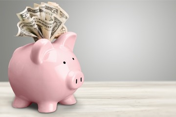 Piggy bank and  money on background