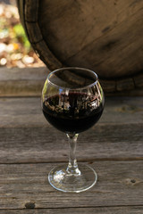 Red wine in wineglass on a gray background