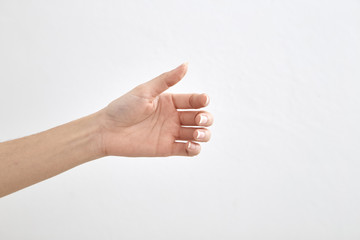 empty female hand on white