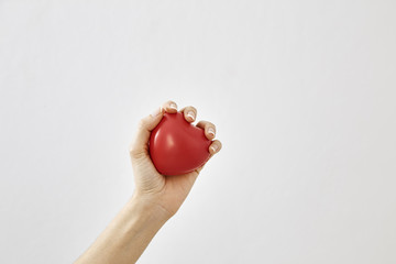 Red heart shape in hand