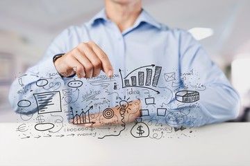 Businessman and  analytics symbols on  background
