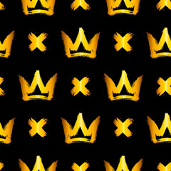 Obraz premium Seamless pattern with golden hand-drawn crowns and crosses on black background. Rough brush painted shapes vector backdrop. Ink street-style abstract grunge illustration.