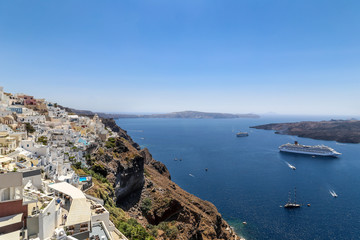 Big cruise liners near the Greek Islands. Bright turquoise sea and blue sky. Santorini island