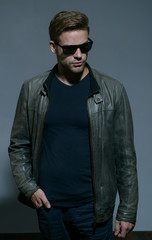 Fototapeta premium My glasses as unique as me. Fashion eyewear. Handsome man wear eye glasses. Fashion model in trendy sun glasses. Man of fashion. Masculine and powerful