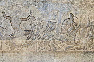 The wall of one of the galleries of Angkor Wat showing episodes from the Hindu epics