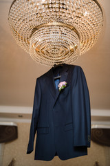men's jacket on a hanger, groom's fees