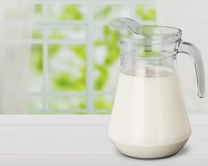 Glass jug of fresh milk