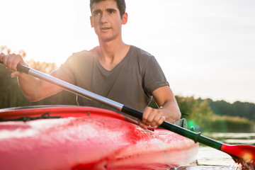 Portrait of a man kayaking on lake