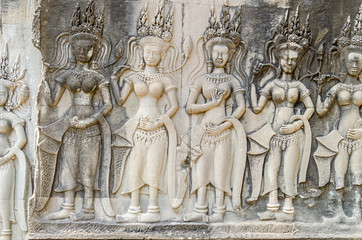 Bas-relief with the devatas adorning the walls of the main complex of Angkor Wat