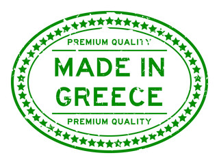 Grunge green premium quality made in Greece oval rubber seal stamp on white background