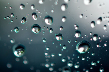 Macro raindrops water on glass