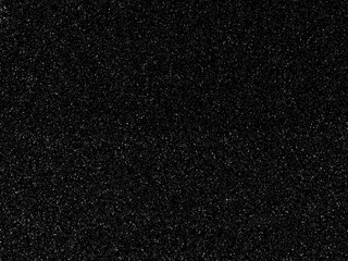 Dark black background with shiny speckles