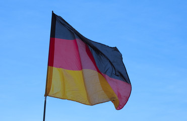 German Flag of Germany over blue sky