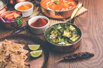 Indian Lunch / Dinner main course food in group includes Paneer Butter Masala, Dal Makhani, Palak Paneer, Roti, Rice etc, Selective focus