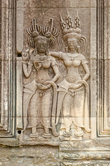 Bas-relief with the devatas adorning the walls of the main complex of Angkor Wat