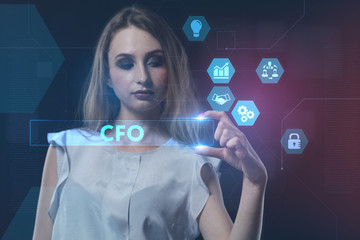 The concept of business, technology, the Internet and the network. A young entrepreneur working on a virtual screen of the future and sees the inscription: CFO
