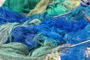 Many fishing nets laid outdoor, drying in the sun. Traditional craft of spain Mallorca, Spain,...