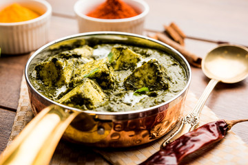 Palak Paneer Curry made up of spinach and cottage cheese served in a bowl or pan with roti or rice