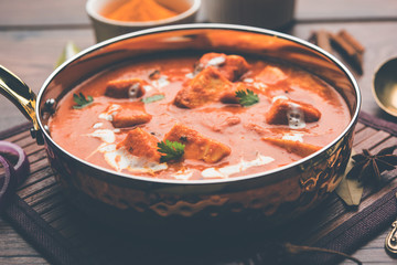 Paneer Butter Masala or Cheese Cottage Curry in serving a bowl or pan, served with or without roti and rice