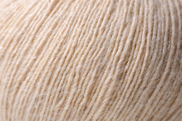 Beige wool thread macro texture material blur background