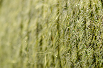 Green wool thread macro texture material blur background