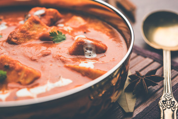 Paneer Butter Masala or Cheese Cottage Curry in serving a bowl or pan, served with or without roti and rice